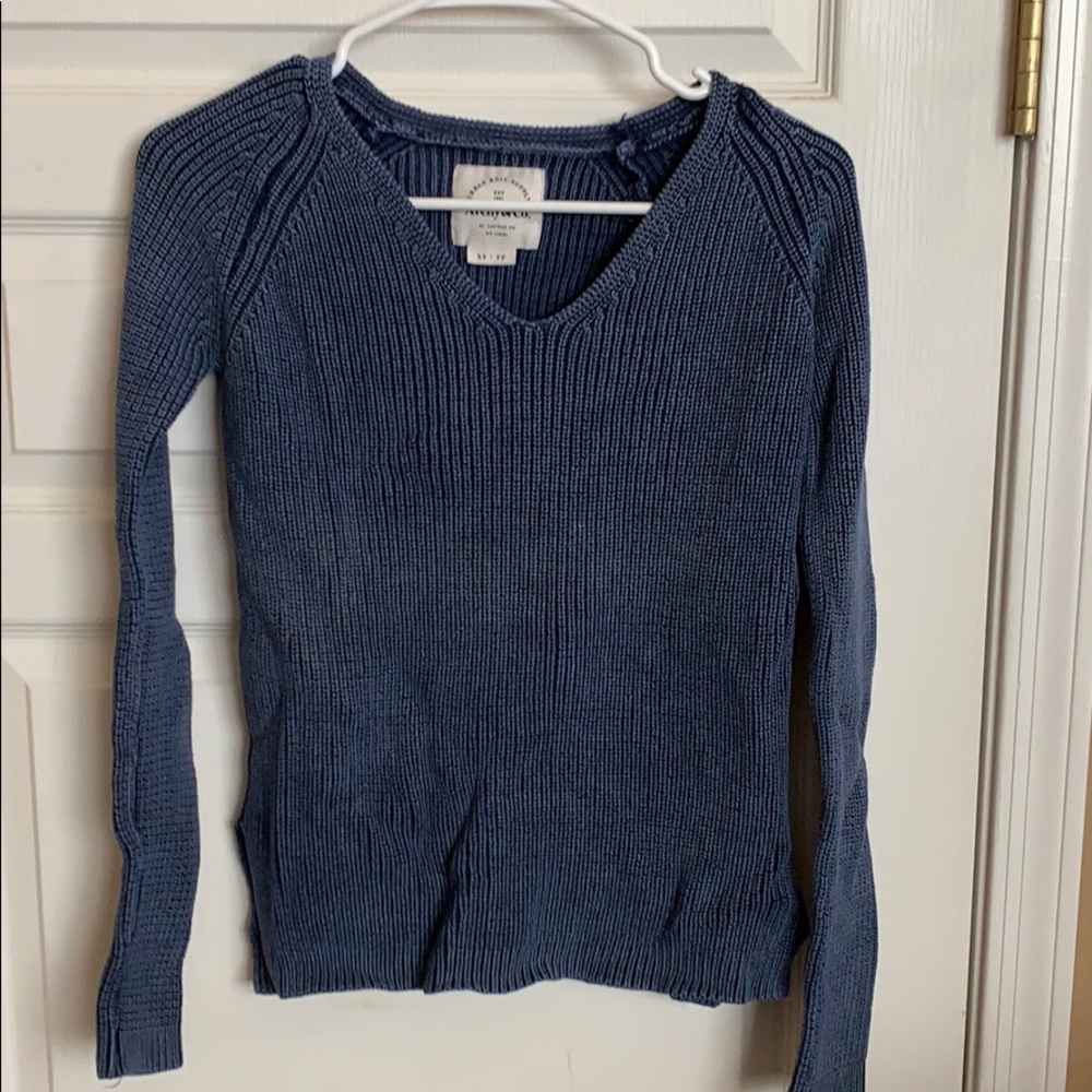Washed out blue sweater